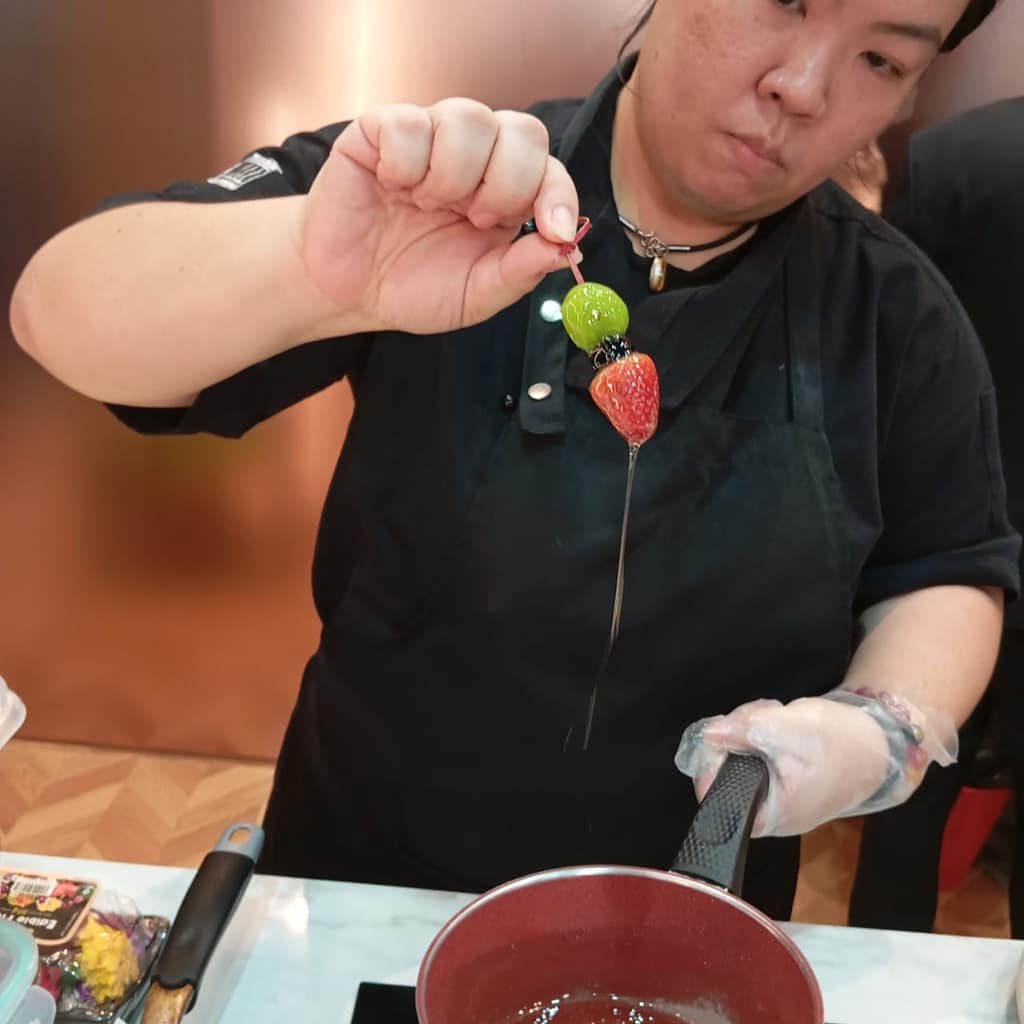 Chef Demonstrating on how to make tanghulu